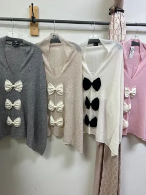 Mitchie’s cashmere ponchos with bows